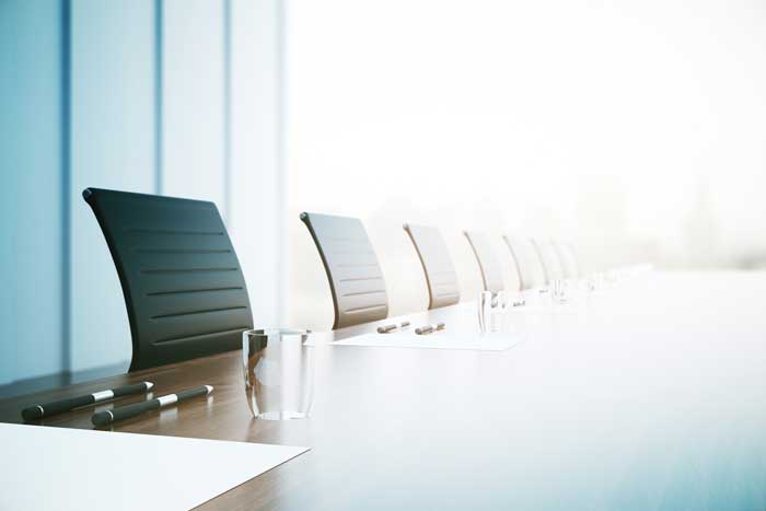 row of chairs at conference table